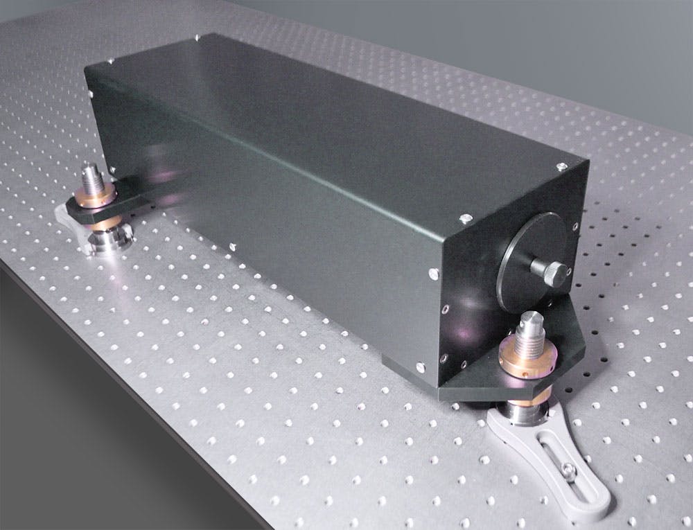 A1-Series Reflective Beam Reducer mounted on an optical table