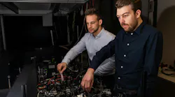 Daniel Timmer (front) and Moritz Gittinger in the lab working on the 2DES setup.