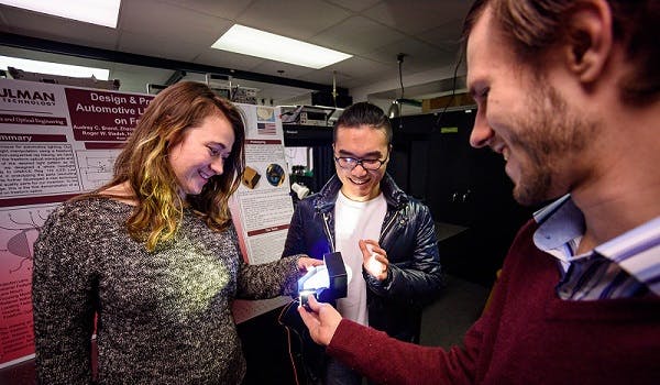 Using freeform optics to redesign automotive LED headlights earned first-place honors at the 2018 Global Capstone Design Fair in South Korea. Team members (from left) are Audrey Brand, Zhaowei Chen, and Simon Tsaoussis. Not pictured is Husam Altoonisi.