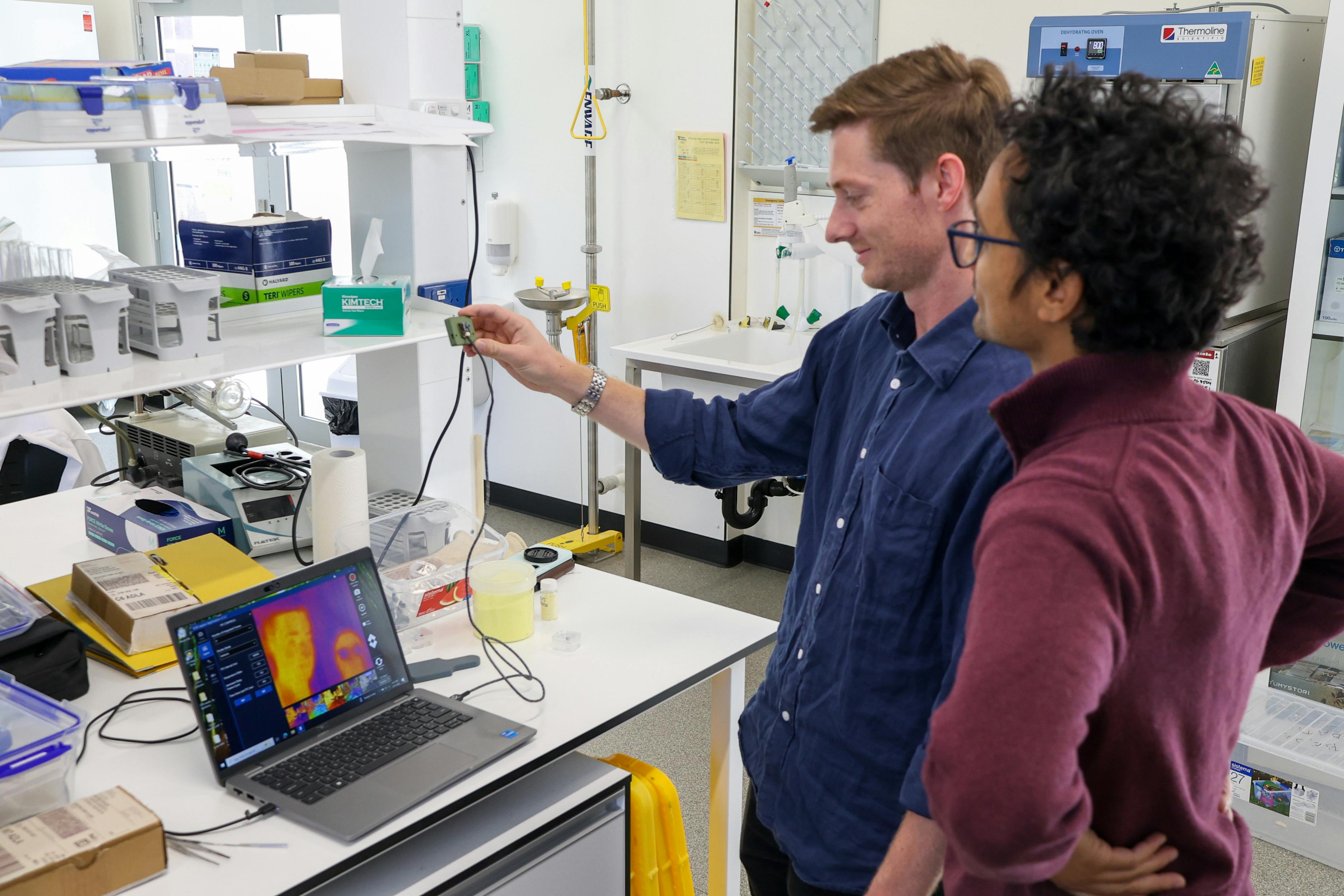 Flinders researchers Dr. Sam Tonkin and Dr. Harshal Patel demonstrate a long-wave IR thermal imaging camera operating with the Flinders polymer lens.
