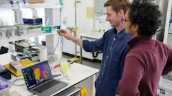 Flinders researchers Dr. Sam Tonkin and Dr. Harshal Patel demonstrate a long-wave IR thermal imaging camera operating with the Flinders polymer lens.