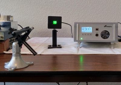 A 17 &times; 17 mm sensor is mounted in a 50.8 &times; 50.8 mm meter head (MH). It is shown here measuring the power emitted from a green laser pointer.