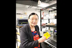 Professor Xiaoke Yi in the lab with her group’s AI nanophotonic chip prototype. Professor Xiaoke Yi in the lab with her group’s AI nanophotonic chip prototype.