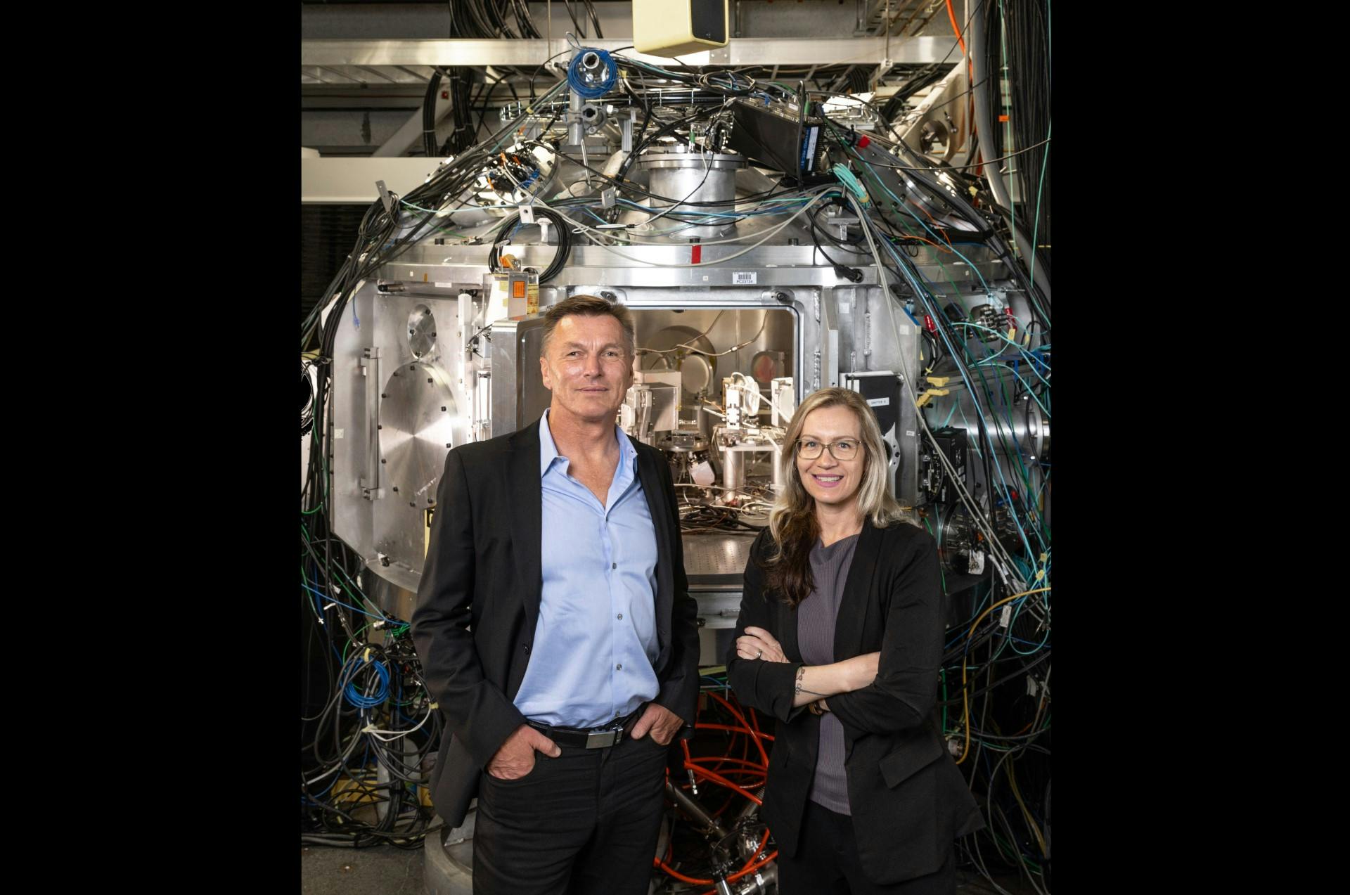 Siegfried Glenzer and Arianna Gleason in front of the chamber for Matter in Extreme Conditions (MEC) instrument at LCLS. Credit: Jacqueline Ramseyer Orrell/SLAC National Accelerator Laboratory