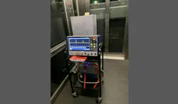 The team’s experimental setup in an elevator: An optical fiber spool is kept within an enclosure for temperature control, while the white case insulates the optical fiber and all other fiber-optic components from the environment. The team’s experimental setup in an elevator: An optical fiber spool is kept within an enclosure for temperature control, while the white case insulates the optical fiber and all other fiber-optic components from the environment.