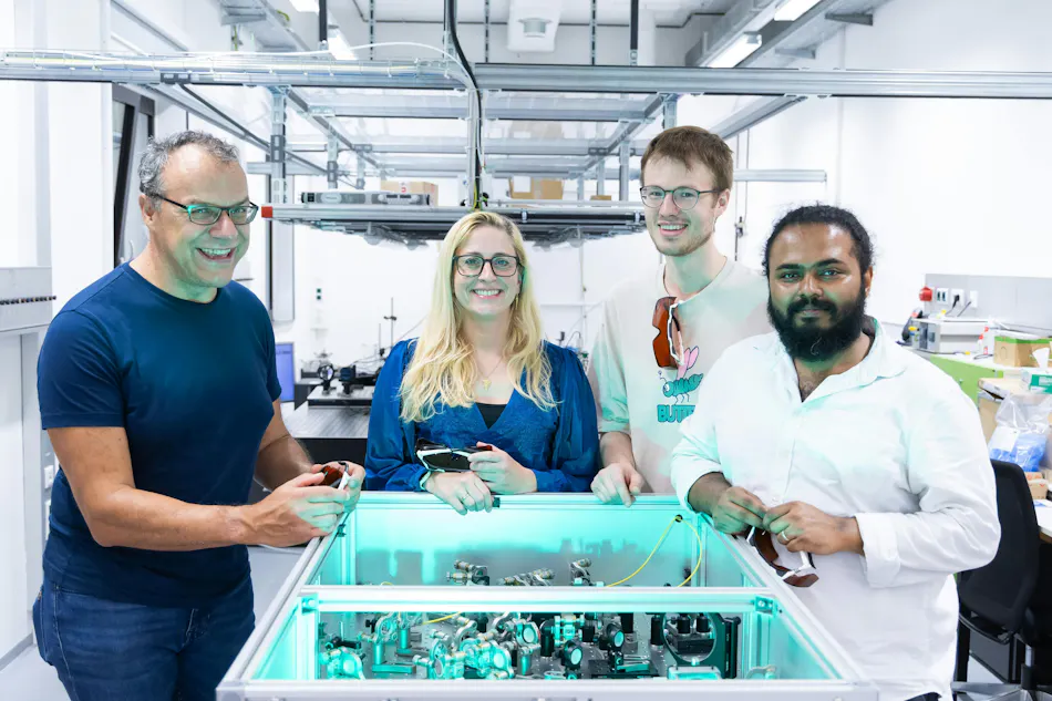 news-950-1 The researchers in the lab with the mobile UV dual-comb spectrometer-(left to right) Rolf Breinbauer, Birgitta Bernhardt, Clemens Hoffman, and Mithun Pal.