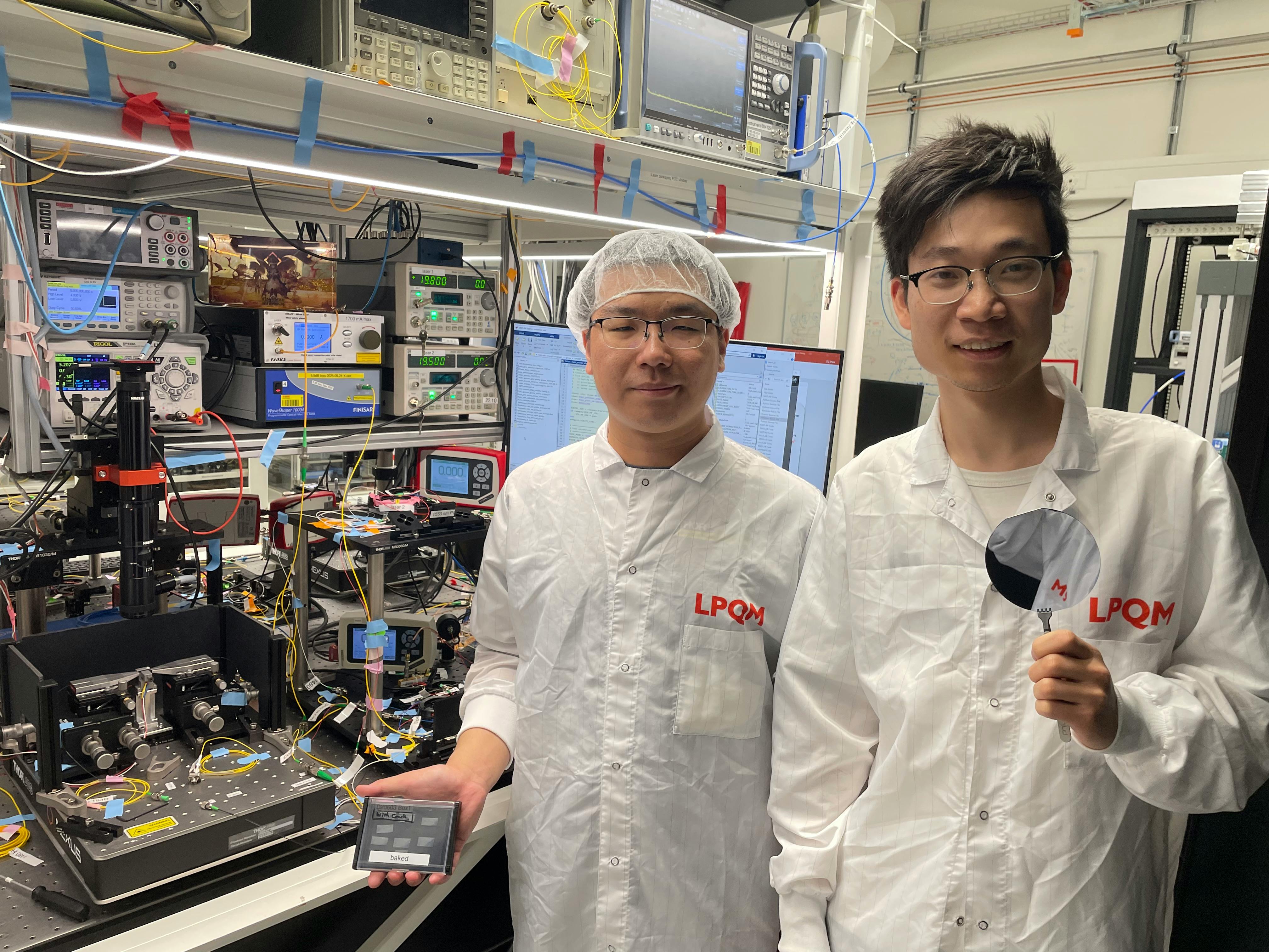 Zheru Qiu and colleague Xuan Yang in the lab with the team&rsquo;s on-chip ultrafast laser.