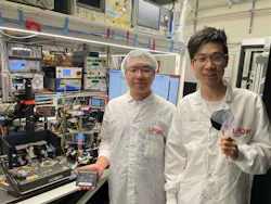 Zheru Qiu and colleague Xuan Yang in the lab with the team’s on-chip ultrafast laser. Zheru Qiu and colleague Xuan Yang in the lab with the team’s on-chip ultrafast laser.