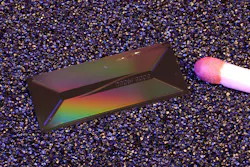 EPFL’s photonic chip shown with a matchhead for (millimeter) scale. EPFL’s photonic chip shown with a matchhead for (millimeter) scale.