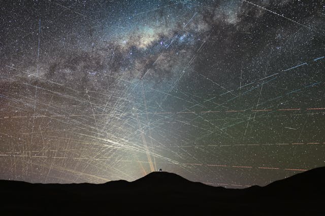Satellites crossing the night sky above the northern Atacama Desert in Chile during an hour. It&rsquo;s a stack of a time-lapse video taken on October 15, 2025, about two hours after sunset. Some streaks are caused by planes, easily identified by blinking-colored lights, but most trails are from satellites. In the foreground is the dome of ESO&rsquo;s Extremely Large Telescope, the world&rsquo;s largest optical/infrared telescope, currently under construction atop Cerro Armazones. Behind it are the lasers of ESO&rsquo;s Very Large Telescope (VLT) at Paranal Observatory, 22 km away.