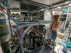 A day in the life of a Ph.D. student: Alice Josset carefully aligns a laser system to the atom interferometer in the Imperial laboratory in South Kensington.