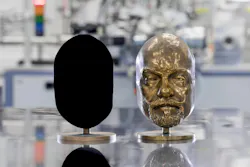 Two identical bronze casts—one is coated with Vantablack 310.