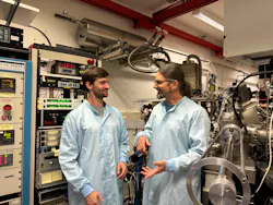 Severin Krüger (left) and Arne Ludwig (right) by the molecular-beam-epitaxy system at Ruhr University Bochum.