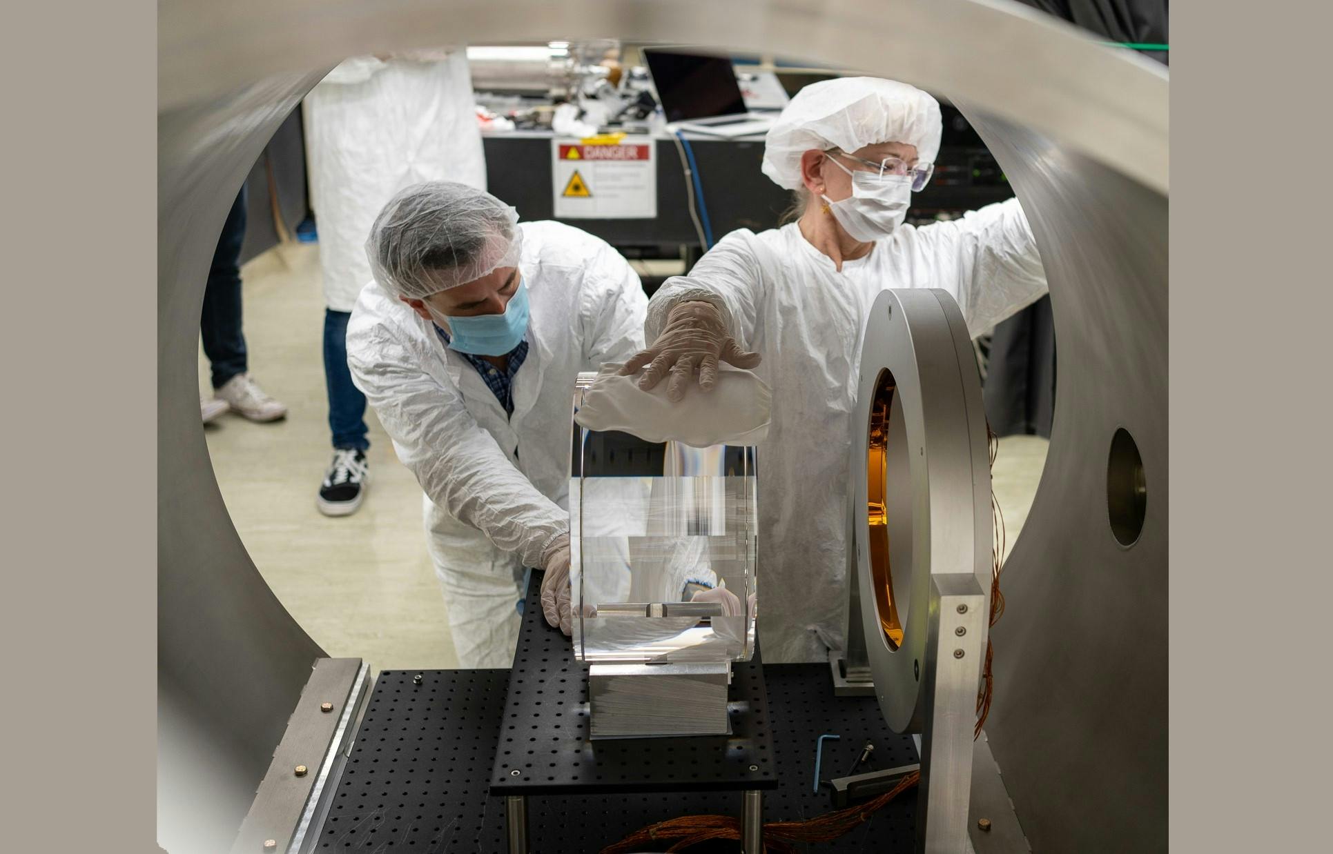 UC Riverside and LIGO Laboratory researchers move a 40-kg LIGO mirror into position to test a prototype FROSTI wavefront actuator in vacuum.